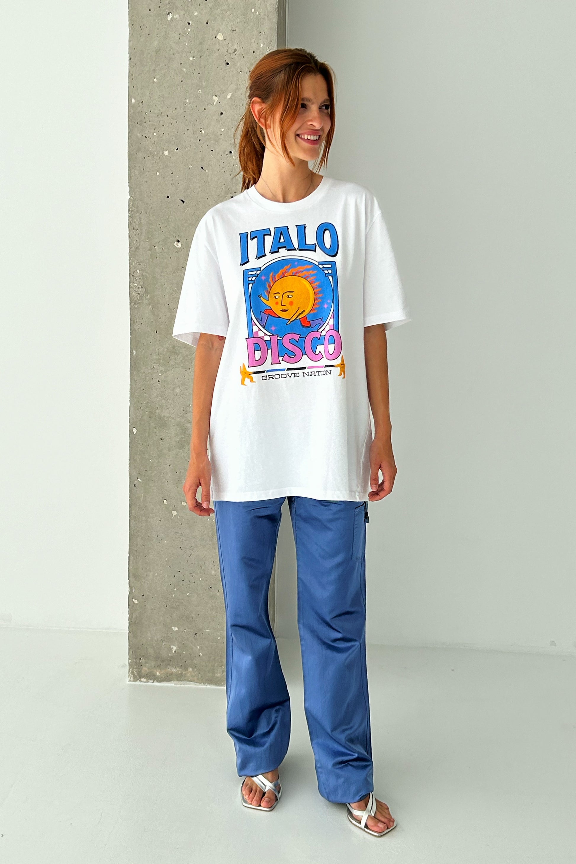 Female Model wearing McIndoe Design's Italo Disco graphic t-shirt in white cotton